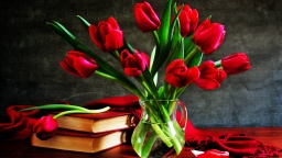 Red Tulips In A Glass Vase